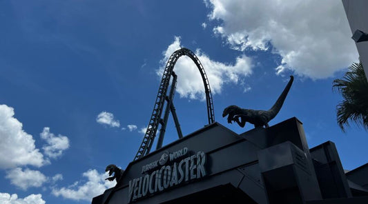 Velocicoaster Entrance with top hat in background